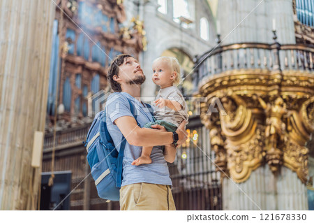 Father and his son tourists exploring the Metropolitan Cathedral in Mexico City. Woman admiring the architecture and history of Mexico's iconic landmark. Concept of cultural heritage, religious Father and his son tourists exploring the Metropolitan Cathedral in Mexico City. Woman admiring the architecture and history of Mexico's iconic landmark. Concept of cultural heritage, religious 121678330