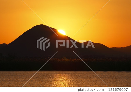 Mount Mikami and sunrise seen from Lake Kihama 121679097