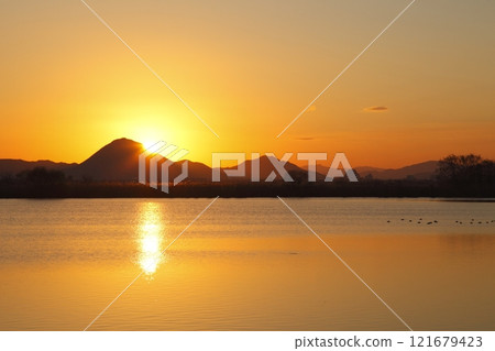 Mount Mikami and sunrise seen from Lake Kihama 121679423