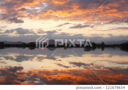 Mount Mikami and sunrise seen from Lake Kihama Mount Mikami and sunrise seen from Lake Kihama 121679634