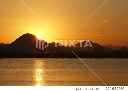 Mount Mikami and sunrise seen from Lake Kihama 121680091