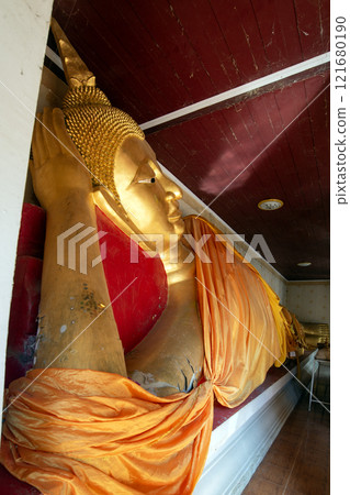 An ancient reclining Buddha that is hundreds of years old. An ancient reclining Buddha that is hundreds of years old. 121680190