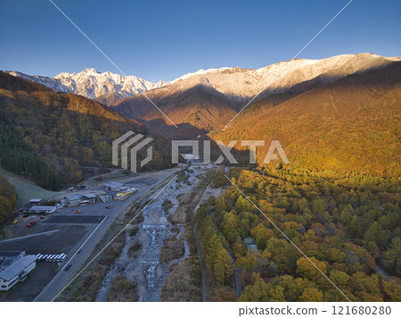 Beautiful Mt. Goryu and the three-tiered autumn foliage seen from the Gentaro area, Hakuba Village, Nagano Prefecture (aerial photography by drone) Beautiful Mt. Goryu and the three-tiered autumn foliage seen from the Gentaro area, Hakuba Village, Nagano Prefecture (aerial photography by drone) 121680280