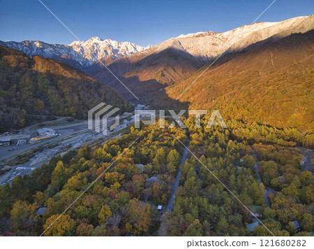 Beautiful Mt. Goryu and the three-tiered autumn foliage seen from the Gentaro area, Hakuba Village, Nagano Prefecture (aerial photography by drone) 121680282