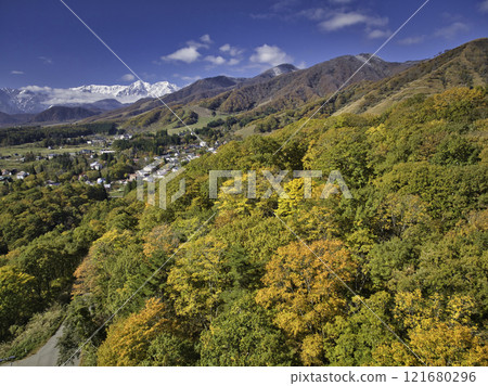 Beautiful three-tiered autumn foliage seen from the Chikuni area, Otari Village, Nagano Prefecture (aerial photography by drone) 121680296