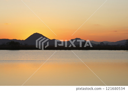 Mount Mikami and sunrise seen from Lake Kihama 121680534
