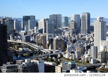 The buildings of Nakanoshima, Tenmabashi, Tenma, Kita-ku, Chuo-ku, and Umeda in Osaka as seen from the lounge at The Fine Tower Otemae 121681138