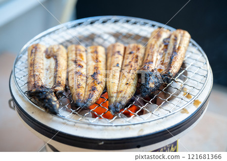 Grilled eel on a charcoal grill Grilled eel on a charcoal grill 121681366