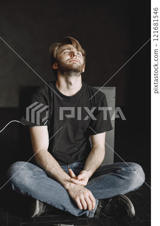 Bad habits problem. Drug addicted man took in dose. He is sitting alone satisfied. Bad habits problem. Drug addicted man took in dose. He is sitting alone satisfied. 121681546