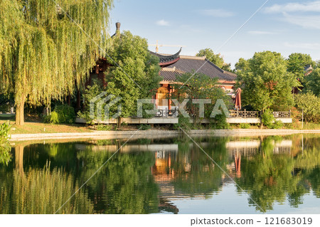 red old building in china with pagodas on the lake shore 121683019