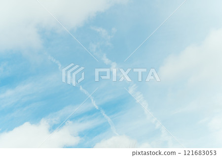 Blue sky, contrails, clouds 121683053