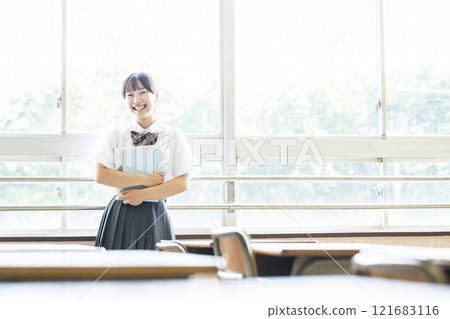 Portrait of a high school girl looking at the camera 121683116