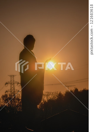 Great Buddha and the first sunrise Great Buddha and the first sunrise 121683618