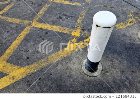 Old Pole with No Parking Yellow Cross Line on the Road. Old Pole with No Parking Yellow Cross Line on the Road. 121684313