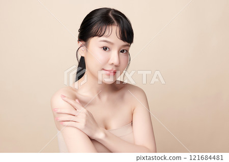 Beautiful young asian woman with clean fresh skin on beige background, Face care, Facial treatment, Cosmetology, beauty and spa, Asian women portrait. 121684481