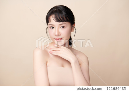 Beautiful young asian woman with clean fresh skin on beige background, Face care, Facial treatment, Cosmetology, beauty and spa, Asian women portrait. 121684485