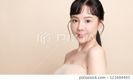 Beautiful young asian woman with clean fresh skin on beige background, Face care, Facial treatment, Cosmetology, beauty and spa, Asian women portrait. Beautiful young asian woman with clean fresh skin on beige background, Face care, Facial treatment, Cosmetology, beauty and spa, Asian women portrait. 121684493