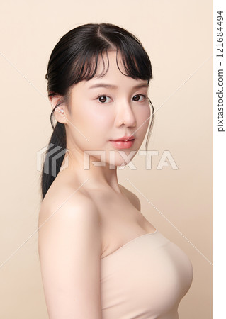 Beautiful young asian woman with clean fresh skin on beige background, Face care, Facial treatment, Cosmetology, beauty and spa, Asian women portrait. 121684494