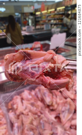 chicken carcass handle by food tong chicken carcass handle by food tong 121684875
