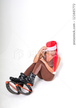 Girl in a New Year's hat and Stylish kangoo shoes 121685772