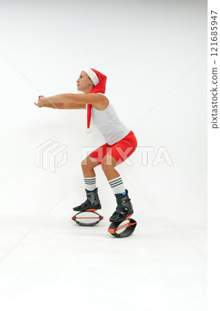 Girl in a New Year's hat and Stylish kangoo shoes 121685947
