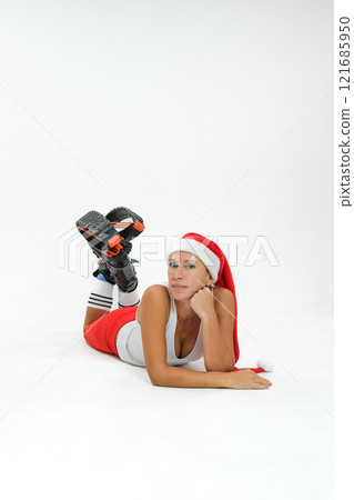 Girl in a New Year's hat and Stylish kangoo shoes 121685950