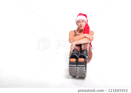 Girl in a New Year's hat and Stylish kangoo shoes 121685952