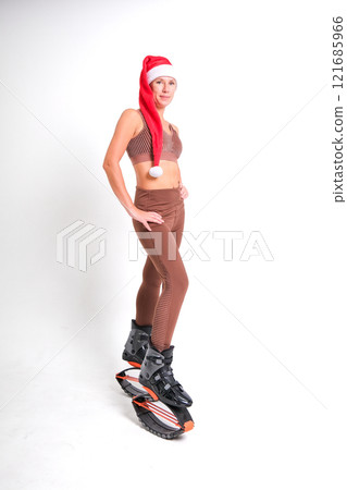 Girl in a New Year's hat and Stylish kangoo shoes 121685966