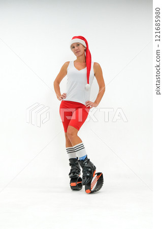 Girl in a New Year's hat and Stylish kangoo shoes 121685980