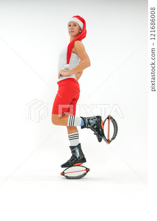 Girl in a New Year's hat and Stylish kangoo shoes 121686008