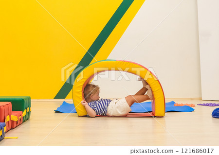 Beautiful blonde baby girl playing in kindergarten Beautiful blonde baby girl playing in kindergarten 121686017