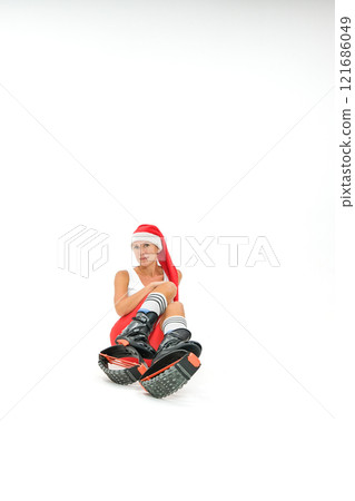 Girl in a New Year's hat and Stylish kangoo shoes 121686049