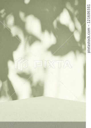 Empty table with Leaves Shadow on Light Green Wall in Vertical Background 121686381