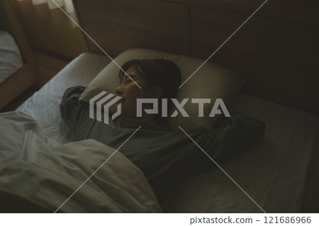 Sleep with your hands under the pillow Sleep with your hands under the pillow 121686966