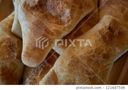 Traditional Asian food, Triangular puff pastry samosas. Fresh baked goods 121687506