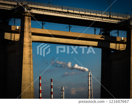 Smoke billowing from a factory chimney - Decarbonization 121687667