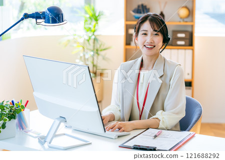 Female operator working in the office 121688292