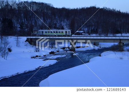 Before dawn, a Furano Line diesel car crosses the silent Biei River Before dawn, a Furano Line diesel car crosses the silent Biei River 121689143