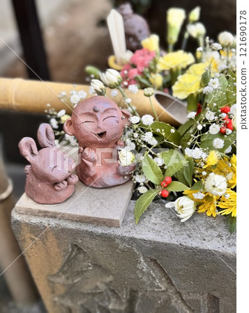Flower water fountain, a small rabbit and Jizo statue Flower water fountain, a small rabbit and Jizo statue 121690178