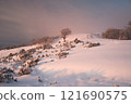 Winter hiking at sunrise 121690575