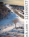 Climbing trail in winter 121690577