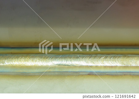 Close up scene the welding line on the metal plate. 121691642