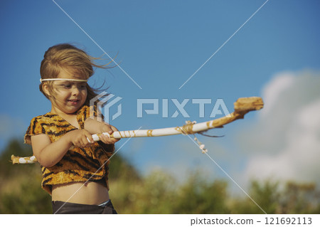 Cute baby dressed in the clothes of primitive people Cute baby dressed in the clothes of primitive people 121692113