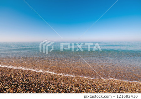 Tropical sand beach with calm wave Tropical sand beach with calm wave 121692410