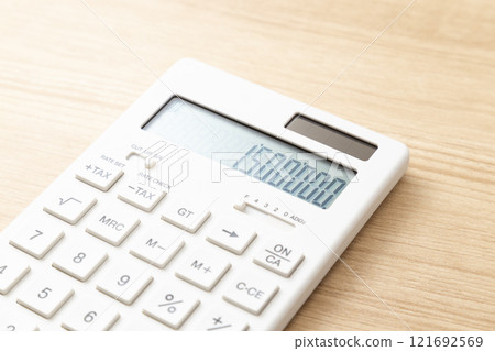 A calculator with 1.5 million displayed on a table A calculator with 1.5 million displayed on a table 121692569