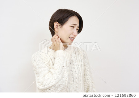 Woman with sensitive skin scratching her neck on white background 121692860