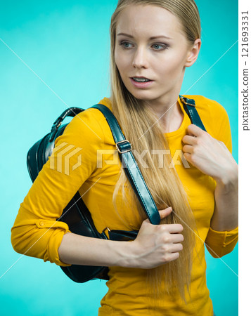 Teen girl with school backpack 121693331