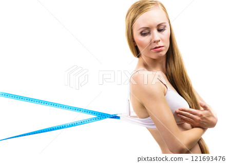 Woman wearing too big bra, loose band Woman wearing too big bra, loose band 121693476