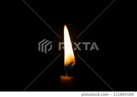 burning candle on black background burning candle on black background 121693508