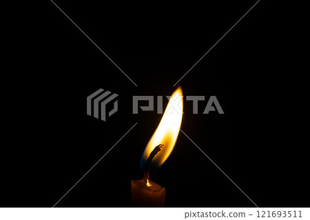 burning candle on black background burning candle on black background 121693511